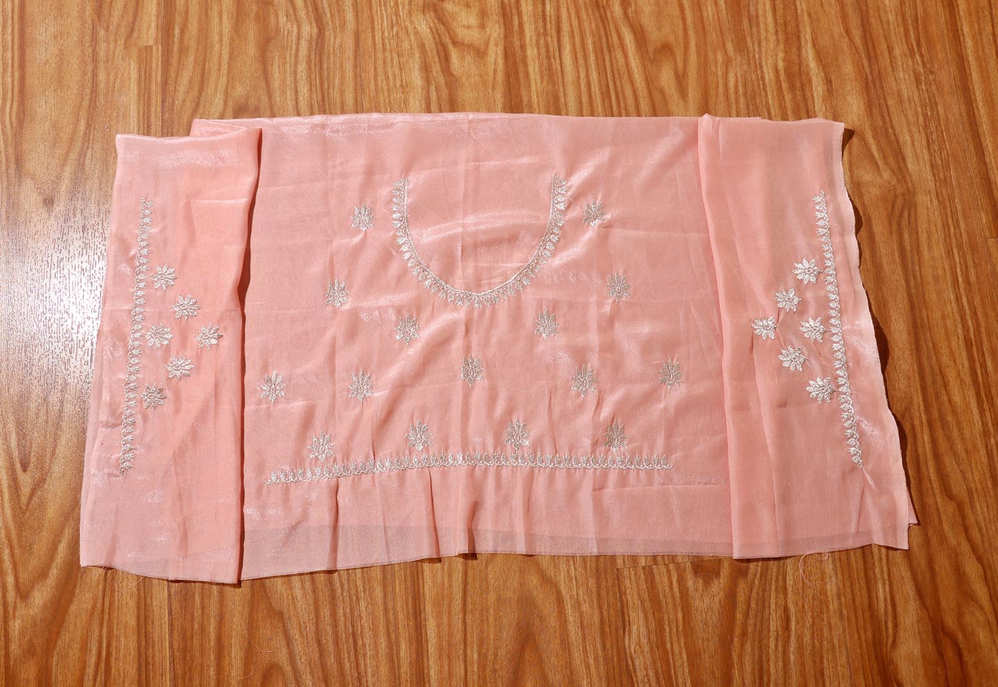 Varnika – Peach Satin Georgette Saree with Silver Embroidery 136